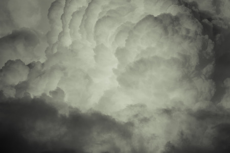 Blue sky with white cumulus clouds. Toned.