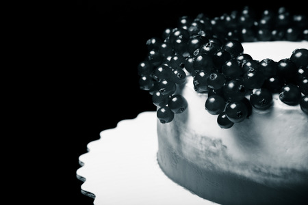 Biscuit homemade cake with cream and berries. Toned.の写真素材