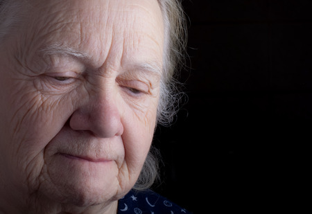 Portrait of elderly woman. Sad. Toned.
