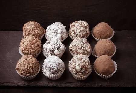Set of different kinds of homemade chocolate truffles. Selective focus. Shallow depth of field. Toned.の写真素材