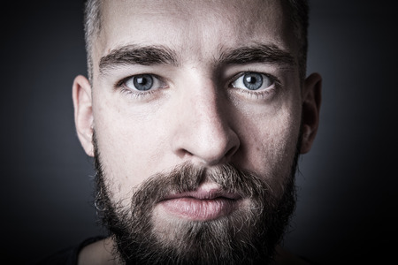 Portrait of a young man with a beard. Toned.の写真素材