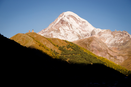 Beautiful sunrise in Stepancminda, Georgia. View to the Kazbek mountain. Toned.