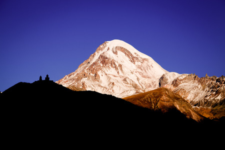 Beautiful sunrise in Stepancminda, Georgia. View to the Kazbek mountain. Toned.