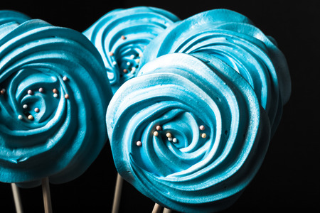 Blue round merengue on a stick. Toned.の写真素材