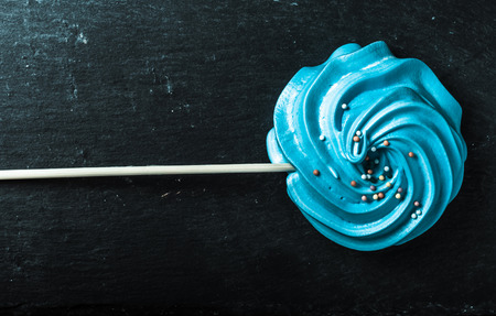 Blue round merengue on a stick. Toned.の写真素材