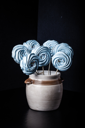 Blue round merengue on a stick. Toned.の写真素材