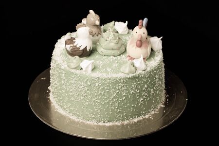 Homemade cake with new year decor on a black background. Toned.の写真素材