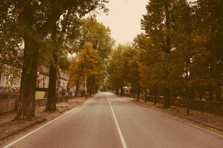 The asphalt road in the small Georgian town. Toned.の写真素材