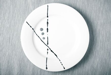 Plate painted strokes of different sauces. Toned.の写真素材