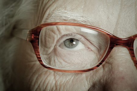 Portrait of elderly woman with glasses. Toned.の写真素材