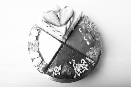 Pieces of homemade cakes with different Valentine's day decor on a light background. Toned.の写真素材