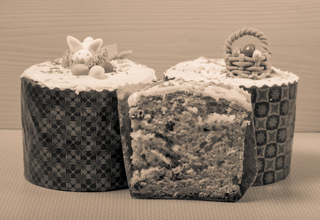 Homemade traditional Easter cake on a wooden background. Toned.