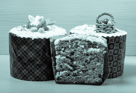 Homemade traditional Easter cake on a wooden background. Toned.