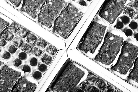 Set of different kinds of natural desserts in a carton box. Toned.の写真素材