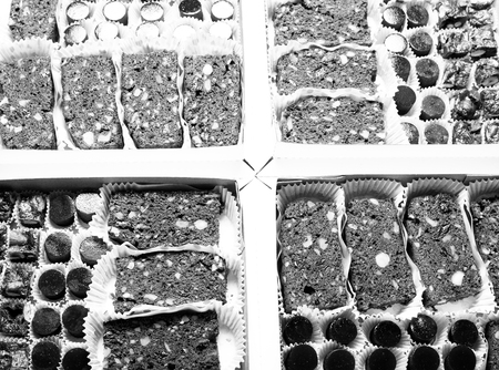 Set of different kinds of natural desserts in a carton box. Toned.