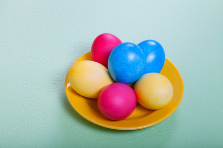 Easter symbols - colored eggs on light background.の写真素材