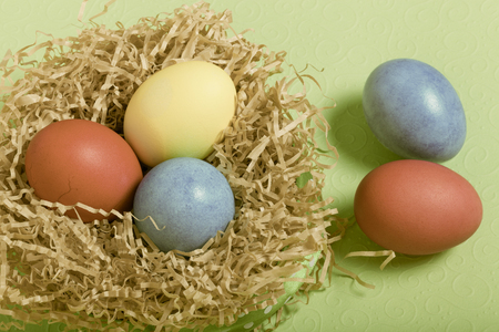 Easter symbols - colored eggs on light background.の写真素材