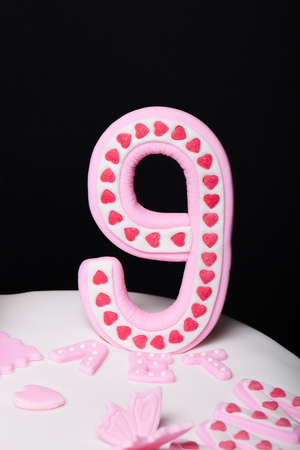 Fragment of cake with mastic for children's birthday.の写真素材