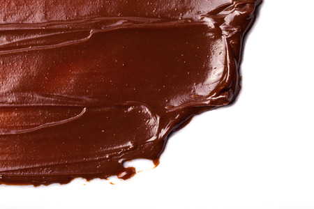 Texture of smears of soft chocolate for a background. Selective focus.