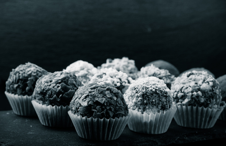 Set of different kinds of homemade chocolate truffles. Selective focus. Shallow depth of field. Toned.の写真素材