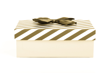 Pink gift box with a lid in a white and blue stripes and a blue satin bow. Toned.の写真素材