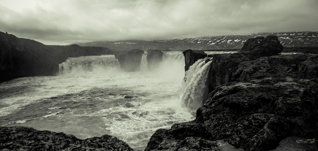 The Godafoss Waterfall - beautiful part of stony rocky desert landscape of Iceland. Toned.