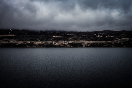 Huge cold lake on the stony rocky desert landscape of Iceland. Toned.