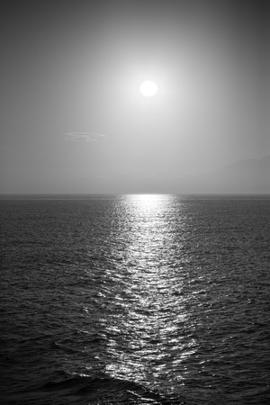 Bright sunset path on the ocean. Toned.の写真素材