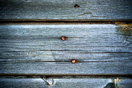 Old wooden planks with peeling paint like background. Toned.の写真素材