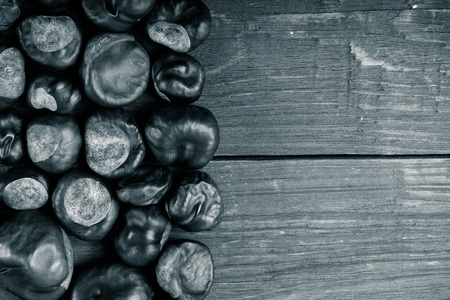 Lot of chestnuts on the old wooden background. Toned.の写真素材