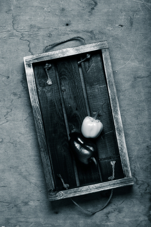 Fresh vegetables and herbs on a wooden burned rustic texture for background. Rough weathered wooden board. Toned.の写真素材