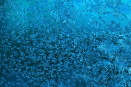 Beautiful nature pattern on frosted glass for background. Toned.