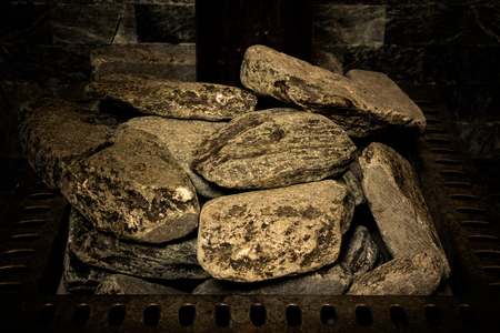 Copper chimney on gray color wall of natural stone. Background texture. Toned.の写真素材