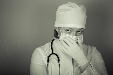 Woman doctor a color background. Selective focus. Toned.の写真素材