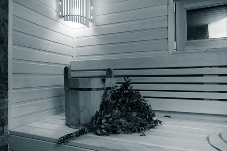Traditional wooden design of sauna. Light and heat in small cozy room. Toned.の写真素材