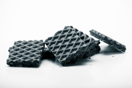 Chocolate waffels on white background. Toned.の写真素材