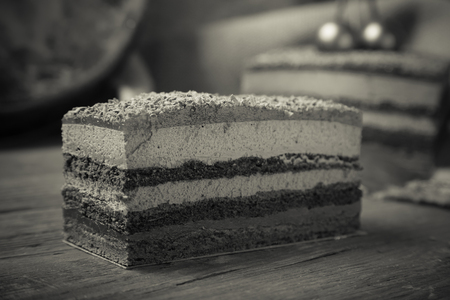 Homemade cherry cake with chocolate decor on a rustic style background. Selective focus. Toned.の写真素材