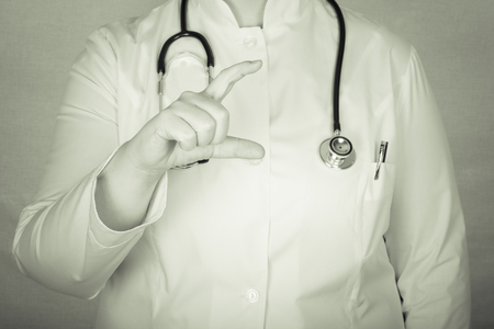 Woman doctor a color background. Selective focus. Toned.の写真素材