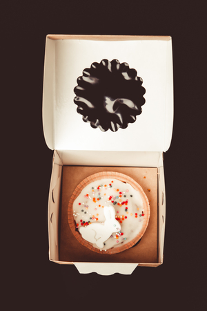 Homemade traditional Easter cake on a dark background. Toned.