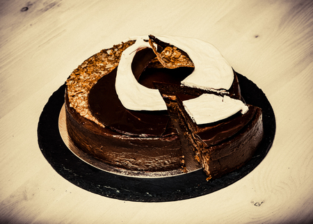 Homemade chocolate cake with spiral decore. Toned.