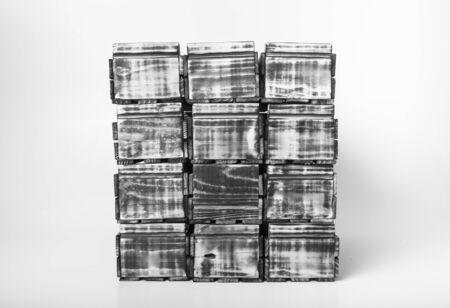 Handmade burned wooden boxes on a light background. Toned.