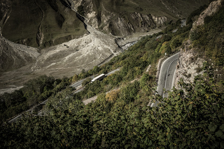 Road serpentine on beautiful autumn mountain landscape in Georgia. Toned.の写真素材