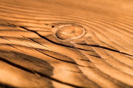 An old board with knots and chips. Wood. Background. Selective focusの写真素材
