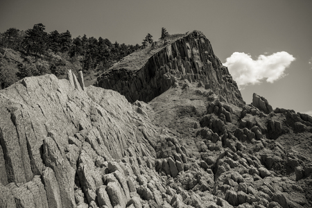 Cape Stolbchaty. Cape on the west coast of the island of Kunashir. It is composed of layers of...