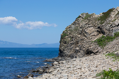 Cape Stolbchaty. Cape on the west coast of the island of Kunashir. It is composed of layers of basaltic lavas of the Mendeleyev volcano.の写真素材