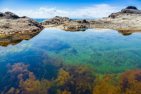 Cape Stolbchaty. Cape on the west coast of the island of Kunashir. It is composed of layers of basaltic lavas of the Mendeleyev volcano.の写真素材