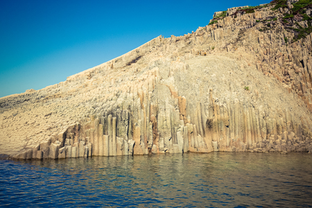 Cape Stolbchaty. Cape on the west coast of the island of Kunashir. It is composed of layers of basaltic lavas of the Mendeleyev volcano.の写真素材