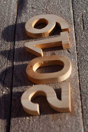 Wooden number 2019 on wooden background. Happy new Year 2019.