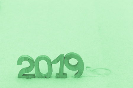 Figures 2019 on the snow. New year and christmas theme. Toned.