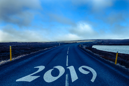 New year and christmas theme: figures 2019 on a road on the beautiful landscape in the east of Iceland. Collage. Toned.の写真素材